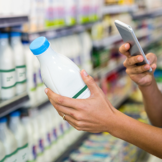 female holding milk bottle